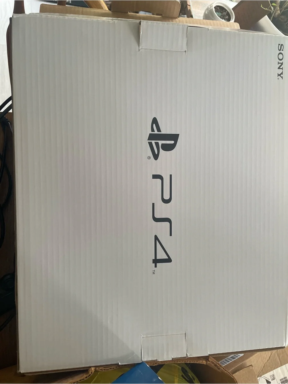 Sony PS4 Console with Black and Blue DualShock Controllers